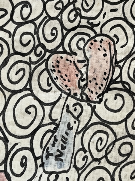 Black swirled pattern with hand drawn broken heart labelled 'For Nellie'
