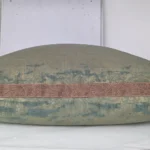 Nymans silk damask cushion during conservation treatment